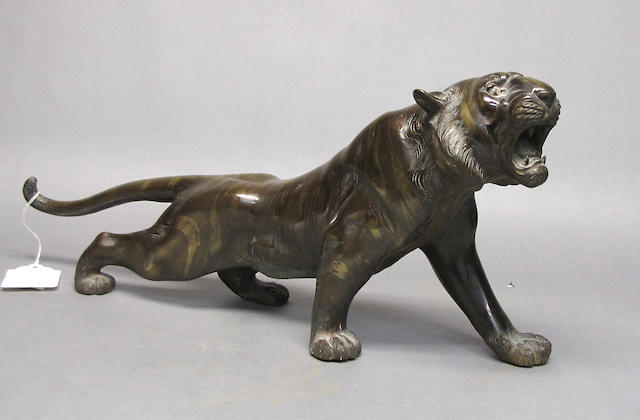 A patinated bronze model of a tiger Meiji Period
