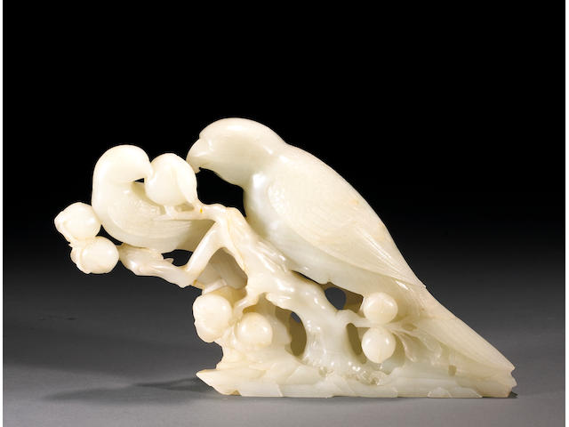 A white jade carving of parrots on a peach branch 18th/19th Century