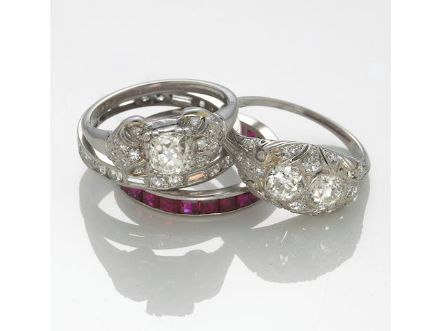 A collection of four diamond and ruby rings