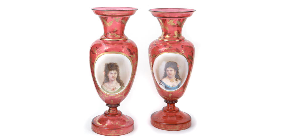 A pair of Bohemian ruby flashed baluster form glass portrait vases