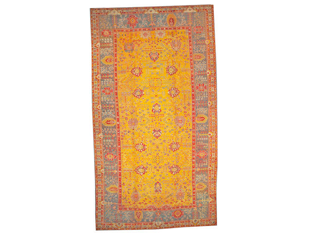 An Oushak carpet West Anatolia size approximately 10ft. 8in. x 19ft. 5in.