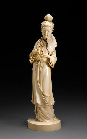 A LARGE STAINED-IVORY MODEL OF A BEAUTY Late 19th century