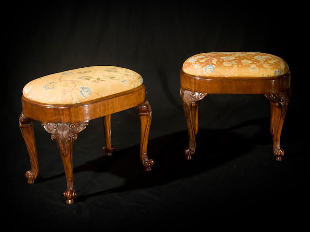 A pair of George III style mahogany stools