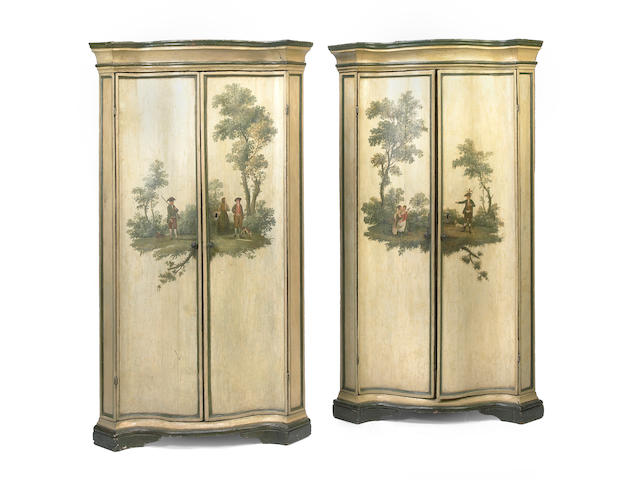 A pair of Italian Baroque later painted corner cupboards
