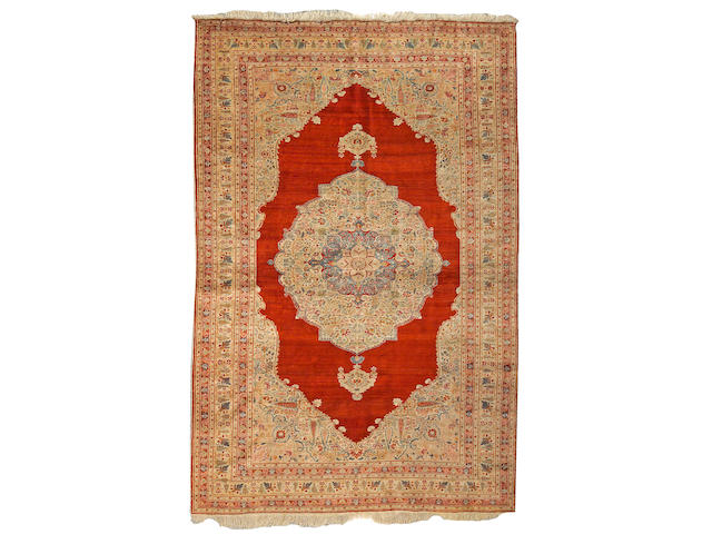 A Tabriz silk carpet Northwest Persia, size approximately 5ft. 5in. x 8ft. 8in.