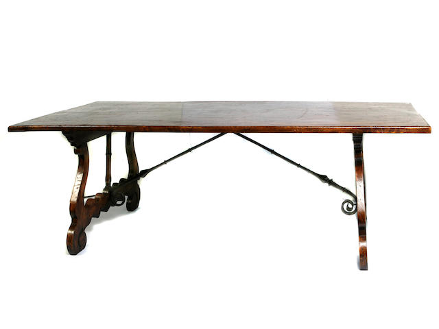 A Spanish Baroque style wrought iron mounted burl elm library table