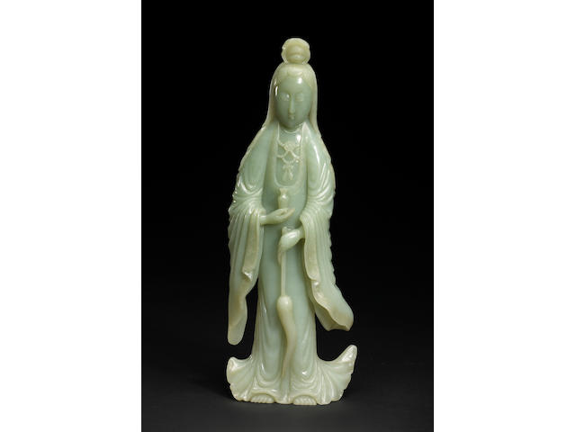 A pale celadon jade figure of Guanyin