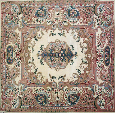 An Indian carpet size approximately 8ft. x 9ft. 8in.