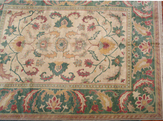 An Indian carpet size approximately 6ft. 3in. x 8ft. 11in.