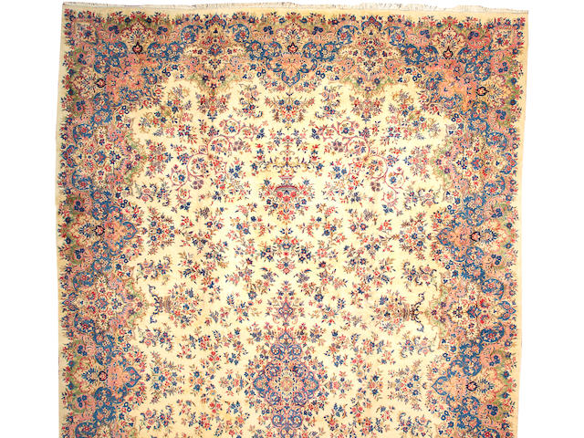 A Kerman carpet size approximately 14ft. 8in. x 25ft.