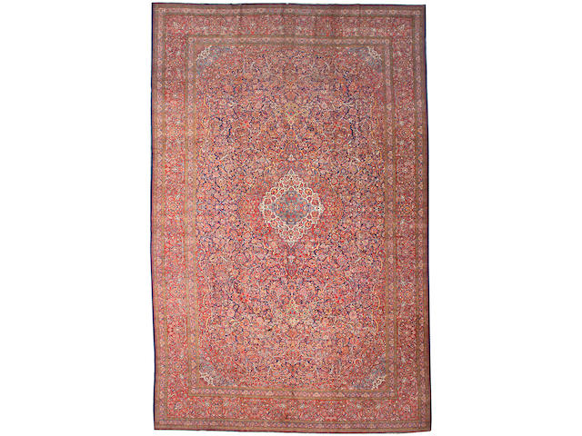 A  Kashan carpet size approximately 11ft. 10in. x 18ft. 6in.