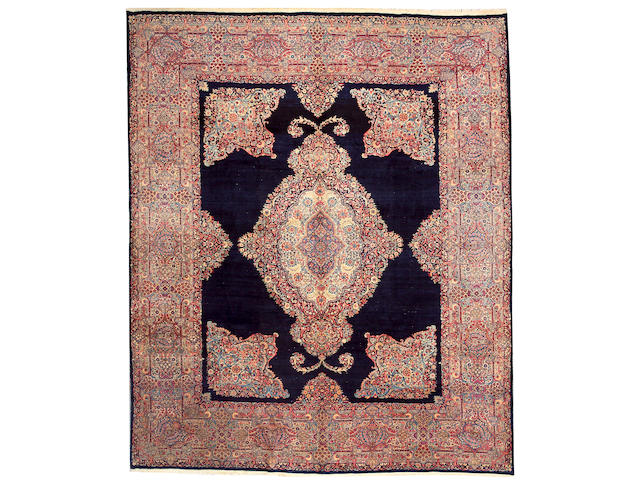 A Kerman carpet size approximately 9ft. 7in. x 11ft. 6in.