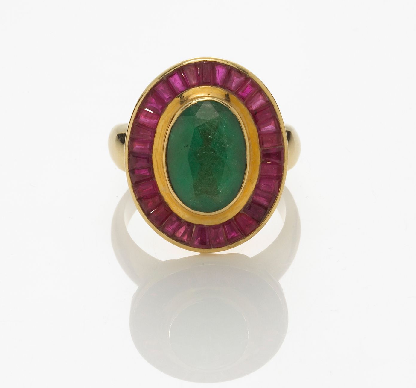 An emerald and ruby ring