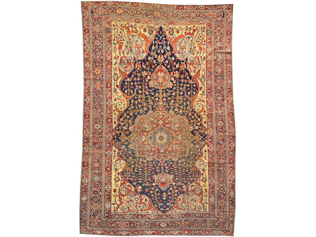 A Fereghan carpet Size approximately 6ft. 10in. x 10ft. 2in.