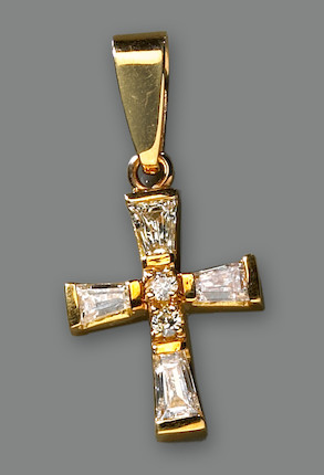 A diamond and 18k gold cross pendant image 1