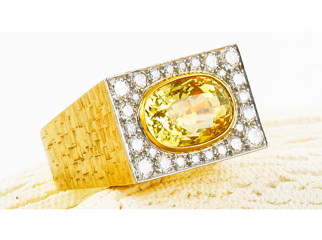A yellow sapphire and diamond ring, Andrew Grima,