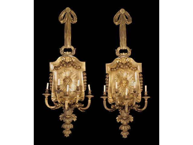A pair of fine and monumental Louis XVI style bronze five light bras de lumi&#232;re early 20th century