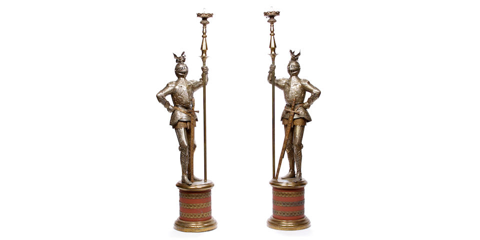 A pair of gilt and silvered metal figural floor lamps modeled as knights