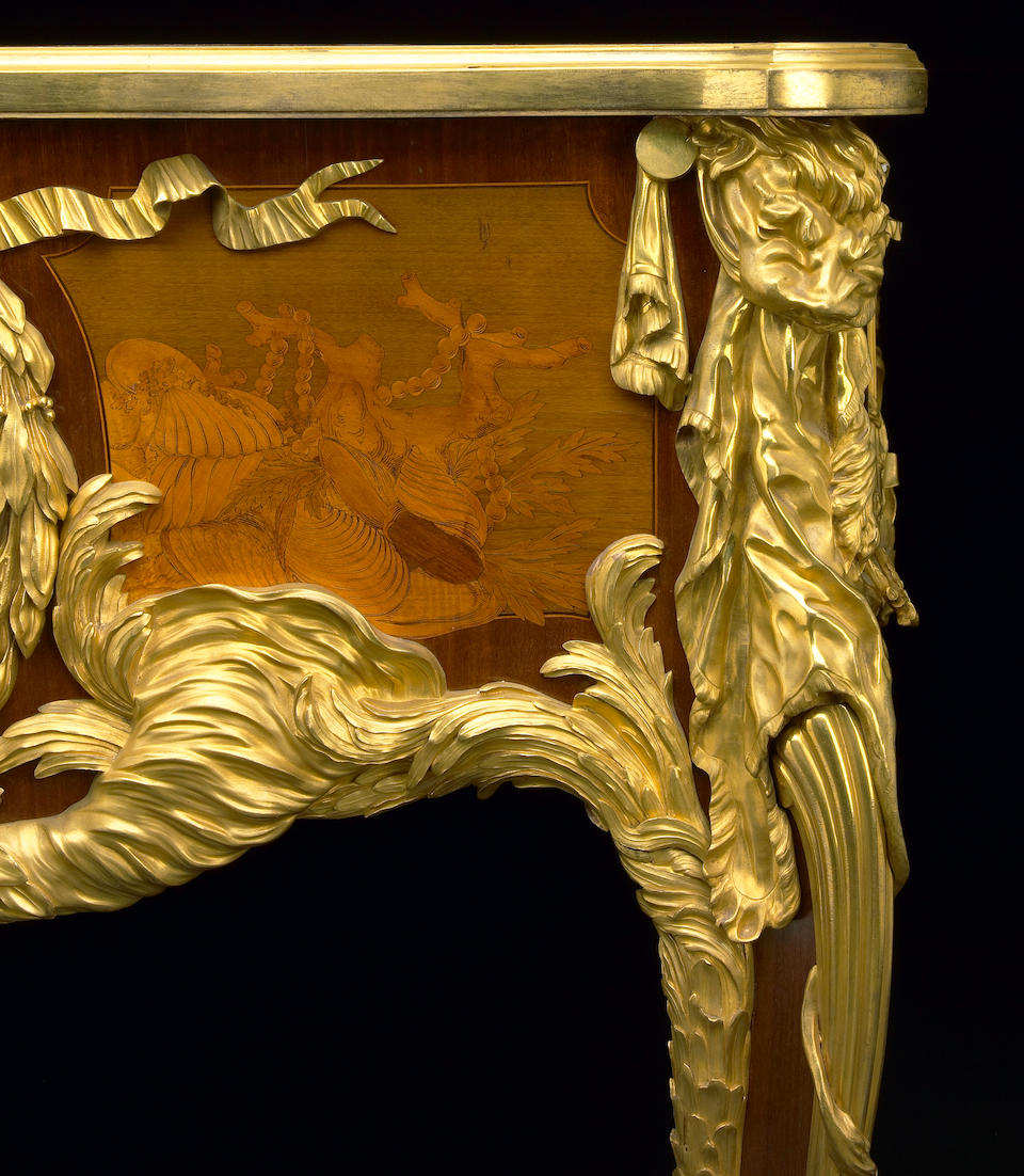 An impressive Louis XV style gilt-bronze mounted marquetry inlaid and bisque porcelain inset bureau plat  Maison Krieger after the bureau du roi by J. -F. Oeben and J. -H. Riesener circa 1900