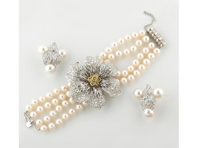 A diamond, colored diamond and cultured pearl bracelet and pair of earrings, Hammerman Bros.
