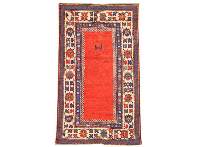 A Kazak rug Caucasus, size approximately 4ft. 7in. x 7ft. 10in.