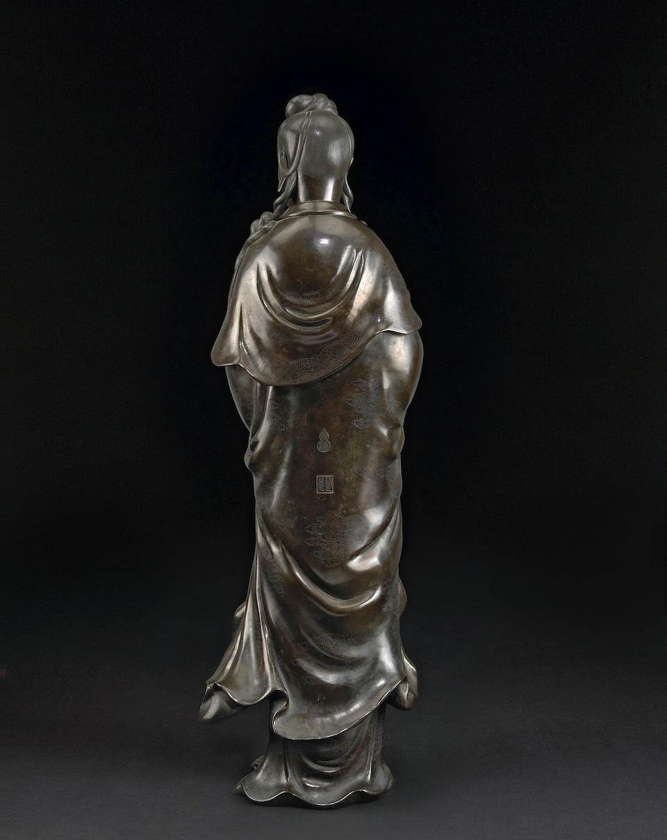 A monumental bronze Guanyin with silver wire inlay Qing Dynasty