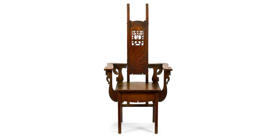 A Charles Rohlfs carved oak armchair