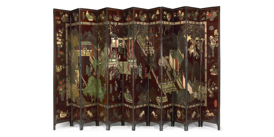 A Chinese twelve panel dark brown lacquer ground coromandel screen 18th/19th century