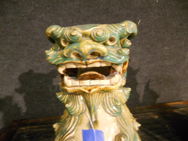 A pair of Chinese glazed ceramic figures of Buddhist lions