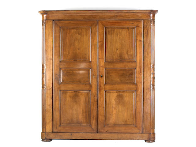 An impressive late Empire mahogany armoire first quarter 19th century