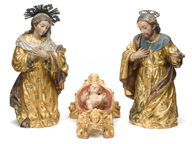A group of three Spanish colonial polychrome decorated carved wood cr&#232;che figures  19th century