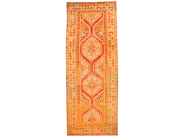 An Oushak long carpet West Anatolia size approximately 8ft. x 21ft.