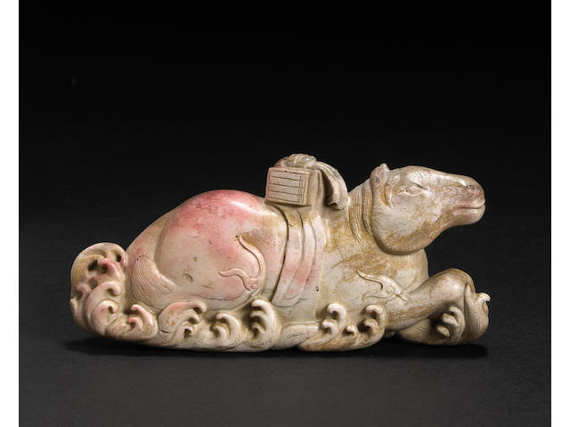 A calcified jade carving of a recumbent horse 20th century