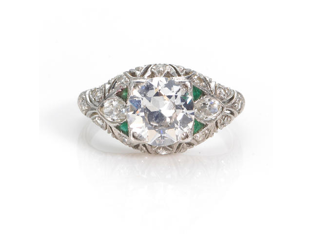 An art deco diamond and emerald ring, circa 1925