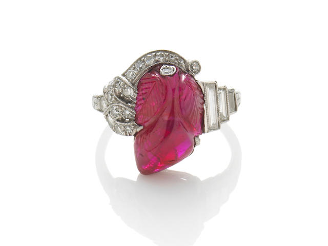 An art deco carved ruby and diamond ring,
