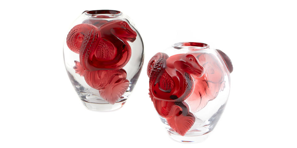 A pair of  Lalique molded clear and ruby glass limited edition Dragon vases editions 33/99 and 82/99
