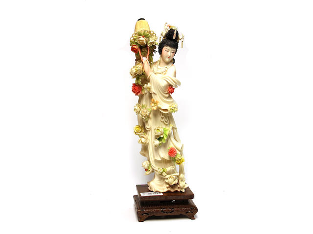 A polychrome tinted ivory flower maiden 20th century