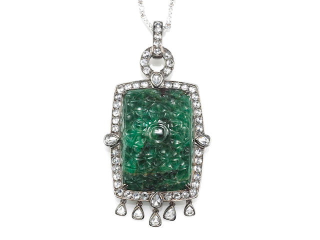 A carved emerald and diamond pendant with diamond chain