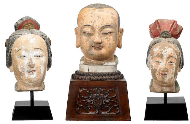 Three stucco heads of donor figures Late Ming dynasty