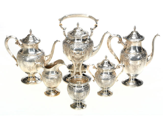 A hand chased sterling six piece tea and coffee set Fisher Silversmiths, Inc., Jersey City, NJ M. Fred Hirsch Co., Inc., Jersey City, NY  St James, #s 2311 (kettle), 411 (others), monogrammed: GEB
