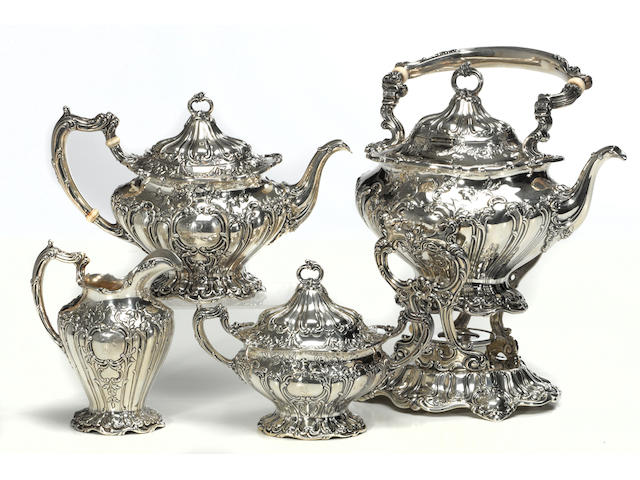 A sterling four piece Chantilly tea set Gorham Mfg. Co., Providence, RI, dated 1902  #s A597, A598, A599 and A601, with hand chased decoration, monogrammed: B, engraved on undersides: C G Berryman, 1902