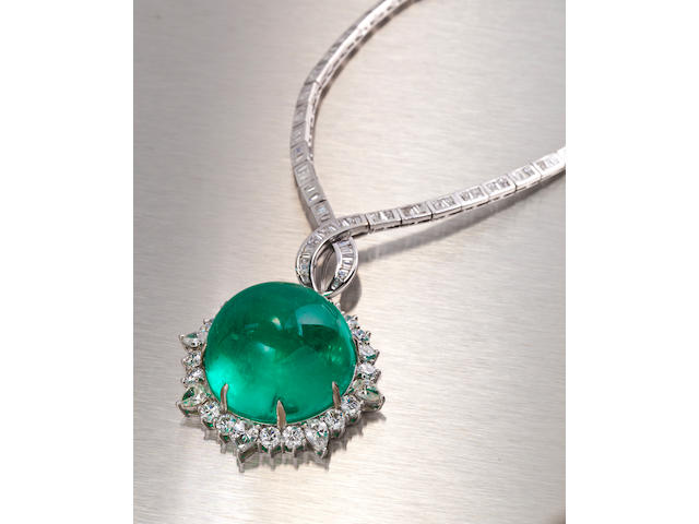 An emerald and diamond pendant necklace
