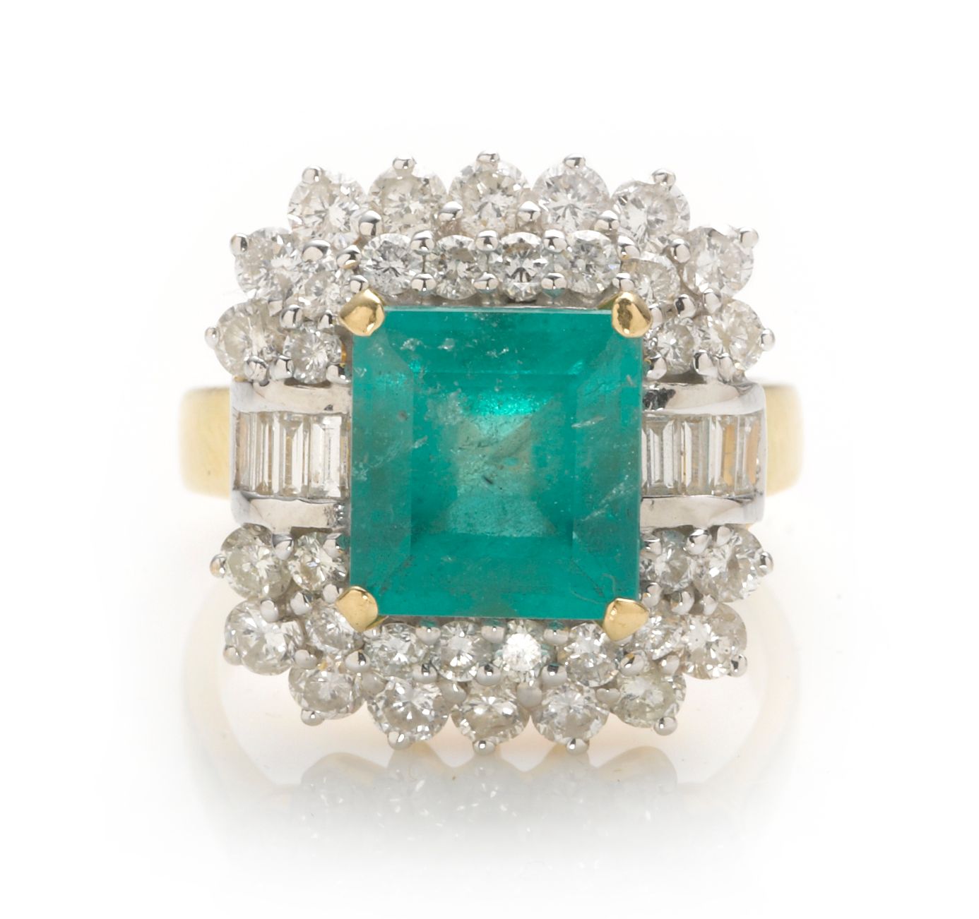 An emerald and diamond ring