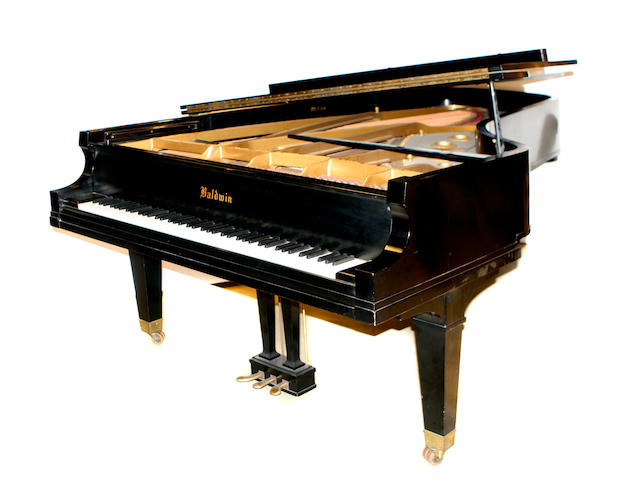 A Baldwin model D ebonized concert grand piano