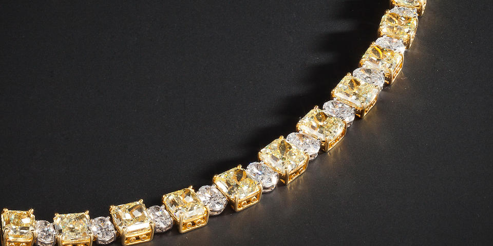A fancy colored diamond and colorless diamond bracelet