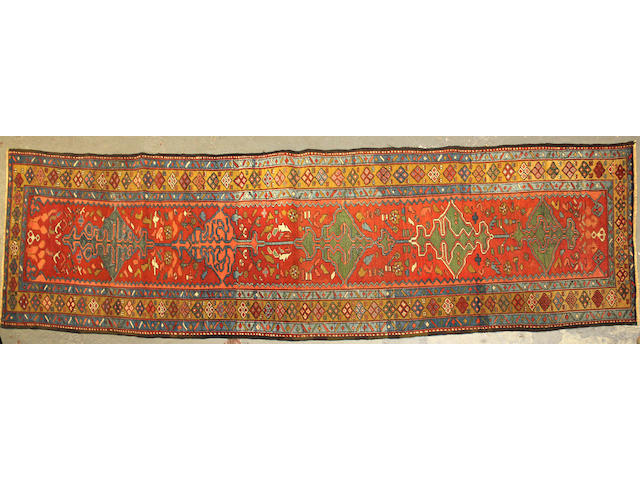 A Serapi runner size approximately 3ft. 3in. x 12ft. 5in.