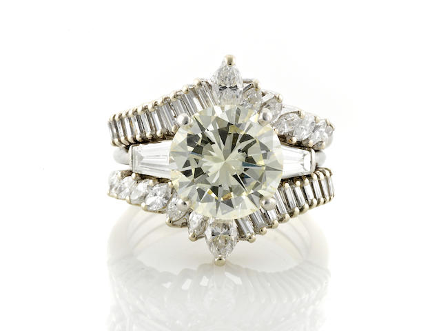 A diamond solitaire ring together with insert ring