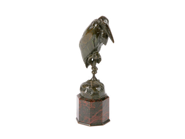 A French patinated bronze model of a heron with snake on base