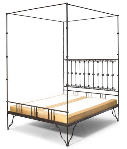 A contemporary patinated metal four poster bed