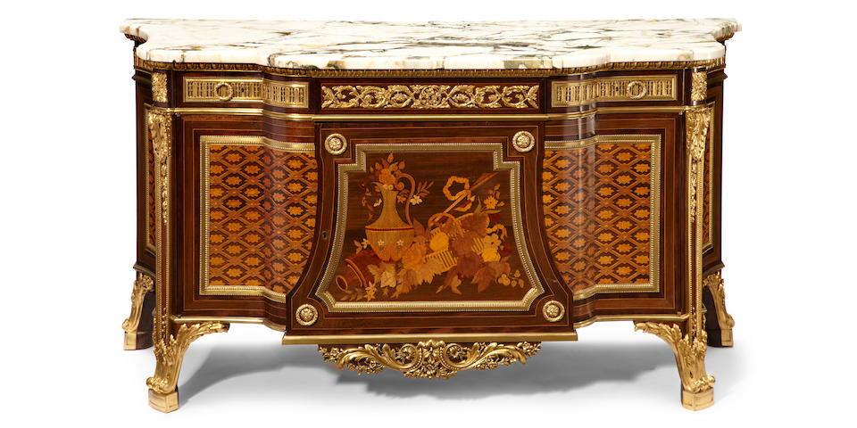 A Louis XVI style gilt bronze mounted marquetry inlaid commode <BR />after a model by Jean Henri Riesener <BR />early 20th century